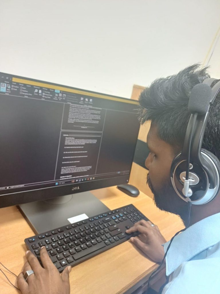 Image of Candidate using computer in the Digital Literacy Lab